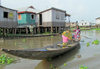 Ganvie, Benin: houses on stilts in the the African Venice - pirogue on Lake Nokou - UNESCO World Heritage Tentative List - photo by G.Frysinger