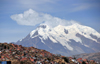 La Paz, Bolivia: southern suburbs and mount llimani with 4 peaks over 6000m - Cordillera Real, Eastern range of the Andes - orogenic cloud formation - photo by M.Torres