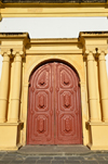 Olinda, Pernambuco, Brazil: red gate of the Cathedral See, flanked by Ionic columns, dedicated to Jesus Christ as Savior of the World - Catedral S de Olinda - Historic Centre of the Town of Olinda, UNESCO World Heritage Site - photo by M.Torres