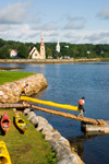 Canada 349 Kayaks and kayakers in the forground and the hisitoric three churches of Mahone Bay, Nova Scotia, Canada in the background - photo by D.Smith