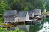 Canada - Old wooden house on stilts at low tide near Peggy's Cove, Nova Scotia, Canada - photo by D.Smith