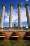 Barcelona, Catalonia: Montjuc - 'Four Columns' by Josep Puig i Cadafalch seen from the Magic Fountain, Palau Nacional in the backgroud - photo by M.Torres