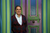 Valparaso, Chile: Chilean man in the colorful doorway of his historic home on Cerro Conception - photo by C.Lovell