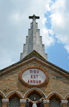 Brazzaville, Congo: Cathedral of the Sacred Heart faade detail - blind arcade, spire and circle with the inscription 'God is love' -  Cathdrale du Sacr Cur / Cathdrale Saint Firmin (1892) - designed by Monseigneur Augouard - Quartier de l'Aiglon - photo by M.Torres