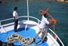 Crete - Chryssi island / Hrisi / Hrissi / Nisos Chrisi (Lassithi prefecture): boat arriving - seaman throwing rope to the quay (photo by Alex Dnieprowsky)