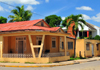 Dajabn, Dominican Republic: street corner - lively colors of Creole architecture - Cibao region - photo by M.Torres