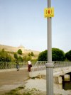 Estonia - Narva: unpretentious stop sign at the Estonian-Russian border (the castle is in Ivangorod, the people are in Narva) (photo by P.Alanko)