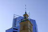 Estonia, Tallinn: Old wooden church spire in front of new skyscraper - SEB - photo by J.Pemberton