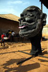 Bissau, Guinea Bissau / Guin Bissau: Bandim quarter, Carnival masks, mask, tabanca, children running, everyday life/ Bairro Bandim, mscaras de Carnaval, preparao, mscara, tabanca, crianas e homens a conversar, vida quotidiana - photo by R.V.Lopes