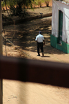 Guinea Bissau / Guin Bissau - Bafat, Bafat Region: policeman walking along the old colonial commercial street, everyday life/ voyeur, polcia a caminhar pela antiga rua comercial do perodo colonial portugus, vida quotidiana - photo by R.V.Lopes