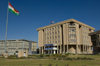 Arbil / Erbil / Irbil / Hawler, Kurdistan, Iraq: Kudish flag flying in front of the Kurdish Parliament - photo by J.Wreford