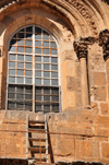 Jerusalem, Israel: Holy Sepulcher church - the'Immovable Ladder' has remained in the same position since 1854, no cleric of the six ecumenical Christian orders may move, rearrange, or alter any property without the consent of all six orders - Christian quarter - photo by M.Torres