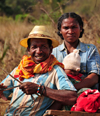 West coast road between the Manambolo river and Belon'i Tsiribihina, Toliara Province, Madagascar: Malagasy family - couple and baby on a cart - photo by M.Torres