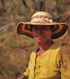 West coast road between the Manambolo river and Belon'i Tsiribihina, Toliara Province, Madagascar: woman with raffia hat - photo by M.Torres