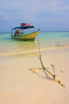 Perhentian Island, Terengganu, Malaysia: Flora Bay - yellow dive boat moored with an anchor on the beach - Malaysian flag - photo by S.Egeberg