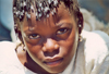 Mali - Segou: girl with plaited hair - at the market - photo by N.Cabana