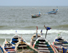 Nouakchott, Mauritania: traditional wooden fishing boats face the waves of the Atlantic Ocean - fishing harbor, the Port de Pche - photo by M.Torres