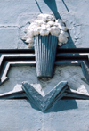 Spain - Melilla: detail of faade decoration - vase with flowers | decoracin de fachada modernista - jarrn de flores - photo by M.Torres