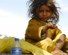 Kathmandu, Nepal: a young girl asks for money on the street - photo by E.Petitalot