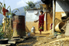 Nepal - Pokhara: rural woman in front of her house - photo by W.Allgwer