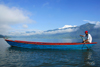 Nepal, Pokhara: boatman on Phewa Tal (Lake) - mountains in the background - photo by J.Pemberton