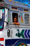 Kathmandu, Nepal: boy leaning out of decorated truck window - photo by J.Pemberton