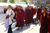 Kathmandu valley, Nepal: woman and monks at Bodhnath / Boudhanath temple complex - known to Newars as Khasti Chitya - photo by W.Allgwer