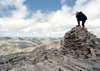 Norway / Norge - Rondane national park (Oppland): a travel photographer at work - man on a cairn (photo by Juraj Kaman)