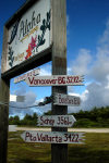 Palmyra Atoll: long way from home - directions post at the airfield - photo by NOAA (in P.D.)