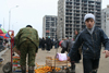 Chechnya, Russia - Grozny - market in front of destroyed buildings - tangerine stall - photo by A.Bley