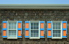 Charlestown, Nevis, St Kitts and Nevis: stone facade with colourful window shutters - Creole architecture - TDC building - photo by M.Torres