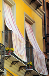 Iglesias / Igrsias, Carbonia-Iglesias province, Sardinia / Sardegna / Sardigna: courtains outside the balconies, protecting against the heat - Piazza A.Lamarmora - photo by M.Torres