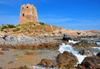 Bari Sardo, Ogliastra province, Sardinia / Sardegna / Sardigna: Torre di Bari - 17th century Aragonese defensive tower resists the waves of the Tyrrhenian Sea - in windy days this is a good beach for surfers - photo by M.Torres