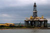 Scotland - Invergordon: North Sea oil rig on Cromarty Firth - GSF Arctic II - rig dwarfs the adjacent workshopI - Global SantaFe Corporation - Semisub still - Rig Design: Friede & Goldman L-907 Enhanced Pacesetter - photo by C.McEachern