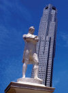 Singapore: Statue of Sir Stamford Raffles and OUB Plaza One - photo by B.Henry