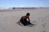 Spain / Espaa - Benicssim / Benicasim - Castell province: boy playing on the beach - Costa dels Tarongersi / Costa del Azahar (photo by W.Schmidt)