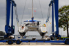 Port of Spain, Trinidad: taking a boat out of the water for repairs - mobile hoist and catamaran - boat handling Equipment - photo by E.Petitalot