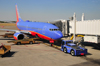 Boise, Idaho, USA: Southwest airlines Boeing 737,  jet bridge and FMC tug  - N212WN - B737-7H4 cn 32485 - Boise Airport - Gowen Field - BOI - photo by M.Torres