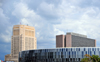 Kansas City, Missouri, USA: Sprint Center indoor arena - 1407 Grand Boulevard, Power and Light District - design by Populous, Ellerbe Becket and 360 Architecture in Futurism style - Jackson County Courthouse and Richard Bolling Federal Building in the background - photo by M.Torres