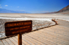 Death Valley National Park, California, USA: Badwater Basin - sign and general view of the valley - looking North - Panamint Range on the left, Amargosa range on the right - photo by M.Torres