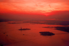 Hudson river (New York): dusk over Ellis Island and the Statue of Liberty - New Jersey on the right - photo by M.Torres