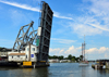 Mystic, CT, USA: Mystic River Bascule Bridgeopens for a sail boat returning to the river - historical drawbridge spanning the Mystic River, built in 1920 -  designed by Thomas Ellis Brown - photo by M.Torres